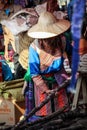 Old flower mong lady is picking a sugar cane at the bac ha market, Lao Cai, Vietnam